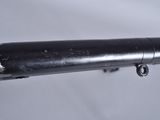 a close up of a metal pipe with a bolt on it
