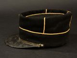 black hat with gold trim on a black background with a black background