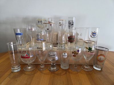 a lot of glasses that are sitting on a table