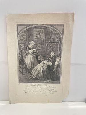 a picture of a woman sitting in a chair in a room