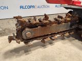 an image of a tractor with a chain attached to it ' s back