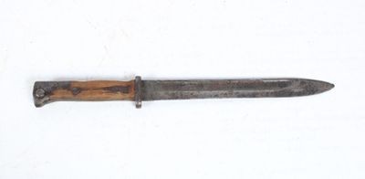 an old knife with a wooden handle on a white surface