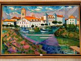 painting on the wall of a building with a boat in the foreground