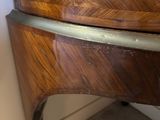 an image of a wooden dresser in the corner of a room