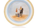 une photo d'une assiette sur laquelle figure l'image d'une calèche