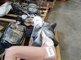 several mannequins are sitting on pallets in a warehouse
