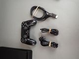 a video game controller and a charger on a table