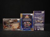 two boxes of card games are sitting on a black surface
