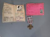 a passport, a medal, and a certificate on the wall
