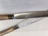 a knife and a knife holder sitting on a table
