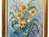 tableau représentant des tournesols dans un cadre doré sur fond bleu