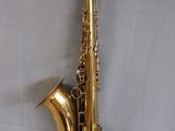 an image of a saxophone that is sitting on a wall