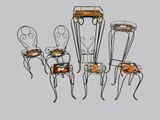 four chairs and a table with a tray on top of them