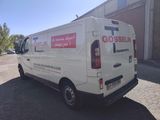 a white van parked in front of a building