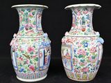 two vases sitting side by side on a black background