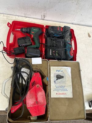 a red box with tools in it sitting on the floor