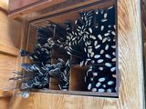many black and white umbrellas in a wooden box