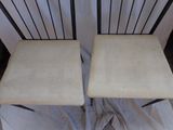 pair of mid - century modern chairs with upholstered seats