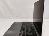 an open laptop computer sitting on top of a white table
