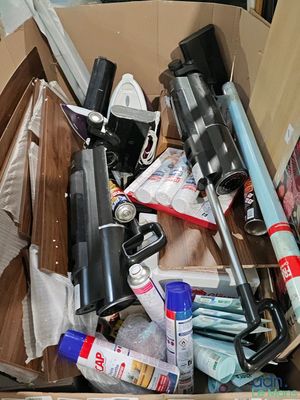 a cardboard box full of assorted items in it