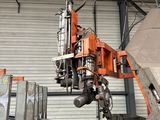 a man that is working on a machine in a building