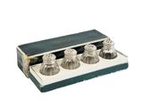 three salt and pepper shakers sitting in a box
