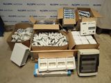 several boxes of electronic equipment are sitting on the floor