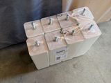 a box of batteries sitting on the floor in front of a wall