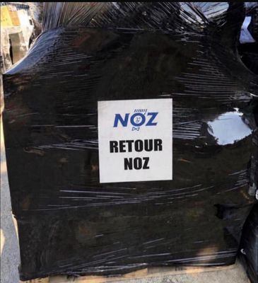 a sign that says noz retour noz on the back of a motorcycle