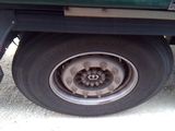 a close up of a flat tire on a truck