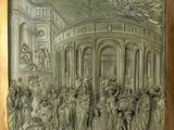 une image représentant un relief en bronze illustrant une scène à l'intérieur d'un bâtiment