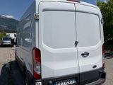a white van that is parked in a parking lot