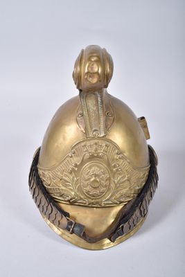 an old brass bell with a dog on top of it