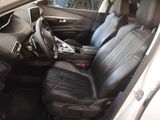 the interior of a car with black leather seats and a steering wheel