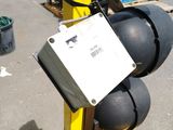 a traffic light that is on a pole in the parking lot