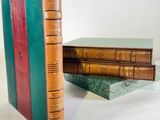 three books stacked on top of each other on a table