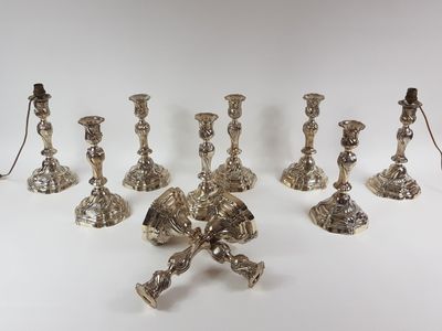 silver plated candlesticks and candlestick holders on a white background
