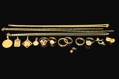 a collection of gold jewellery including rings, bracelets and rings