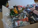 a person holding a box full of assorted toys