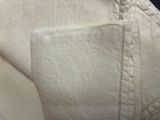 a close up of a white shirt with a pocket