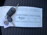 a picture of a car key sitting on top of a car seat