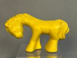 a yellow horse that is standing on a clear surface