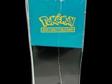 the back of a box of pokemon trading cards on a black background