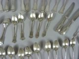 a lot of silver spoons and spoon spoons on a table