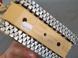 a person holding a box that has a chain attached to it