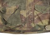 a close up of a military jacket on a white background