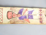 a skateboard with a drawing of a woman on it