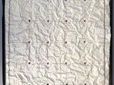 an image of a picture of a piece of paper with holes in it