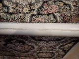 an image of a close up of a chair with a floral upholstered back