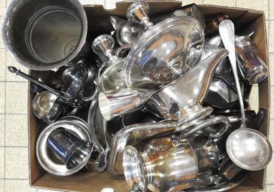 a box full of silver pots and pans on the floor
